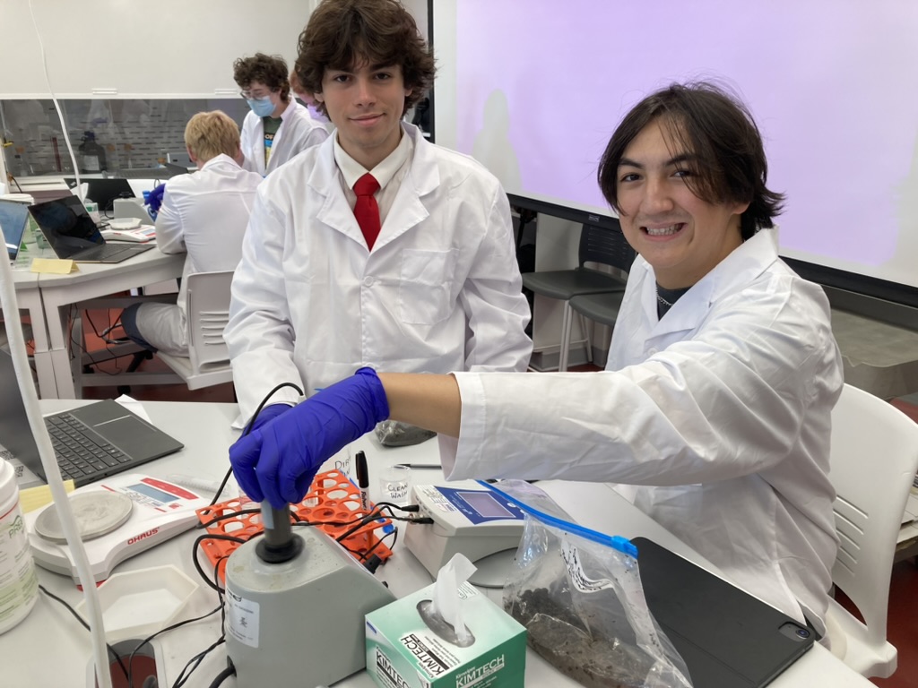 students smiling and using vortexes