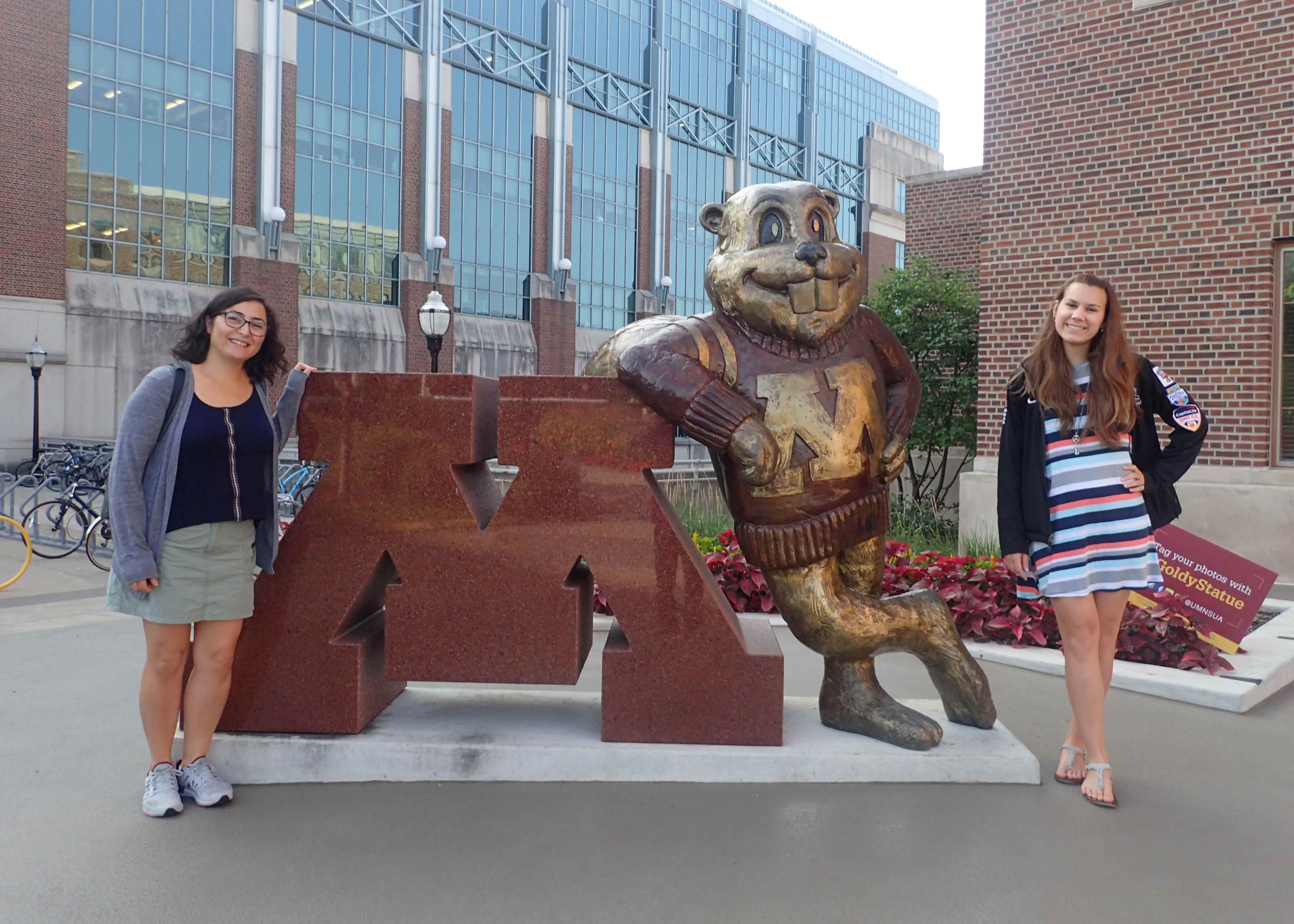 Elizabeth and Sharleen posing with the University of Minnesota mascot, Goldy Gopher