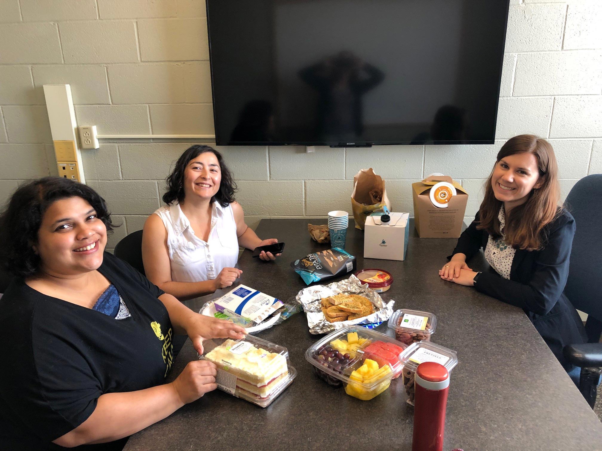 Anupriya, Elizabeth, and Sharleen celebrate Sharleen's exam passing