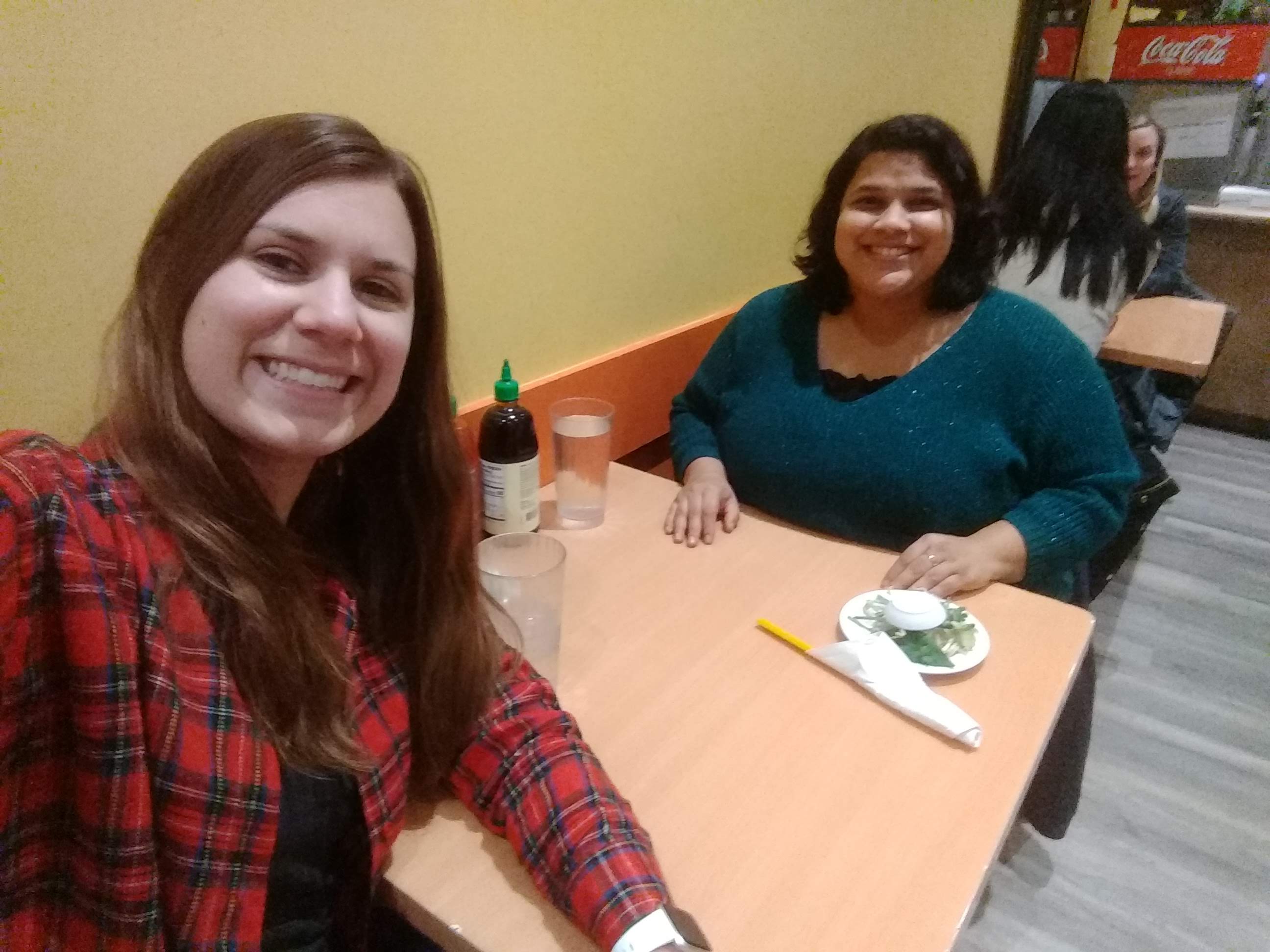 Sharleen and Anupriya celebrating at a pho restaurant.