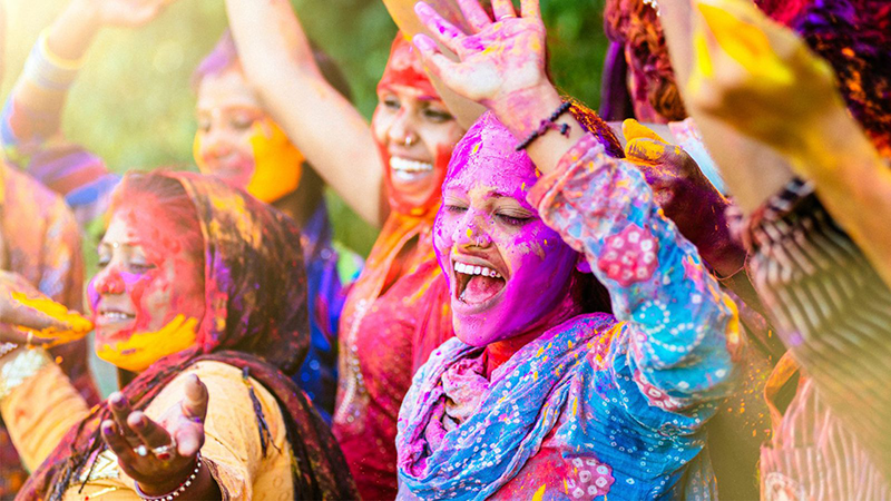 Crowd of people covered in paint