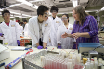 Purdue University ecology and evolutionary biology professor Susan Karcher, far right, answers student questions during a laboratory activity at Lilly Hall