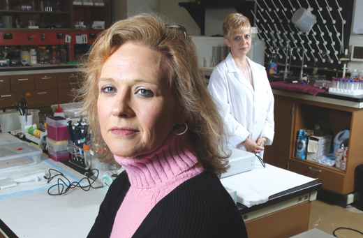 Jacqueline Duncan (foreground), whose life has changed because of health problems caused by ticks, with vector entomologist Cate Hill. (Photo by Tom Campbell)