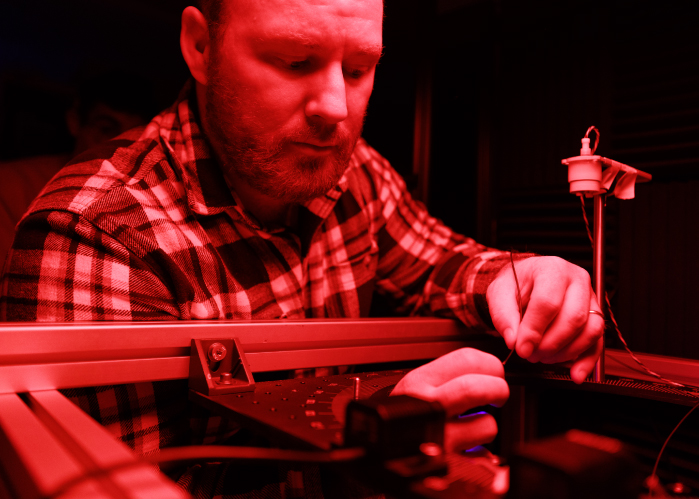 Jimmy Dooley connecting equipment in his lab
